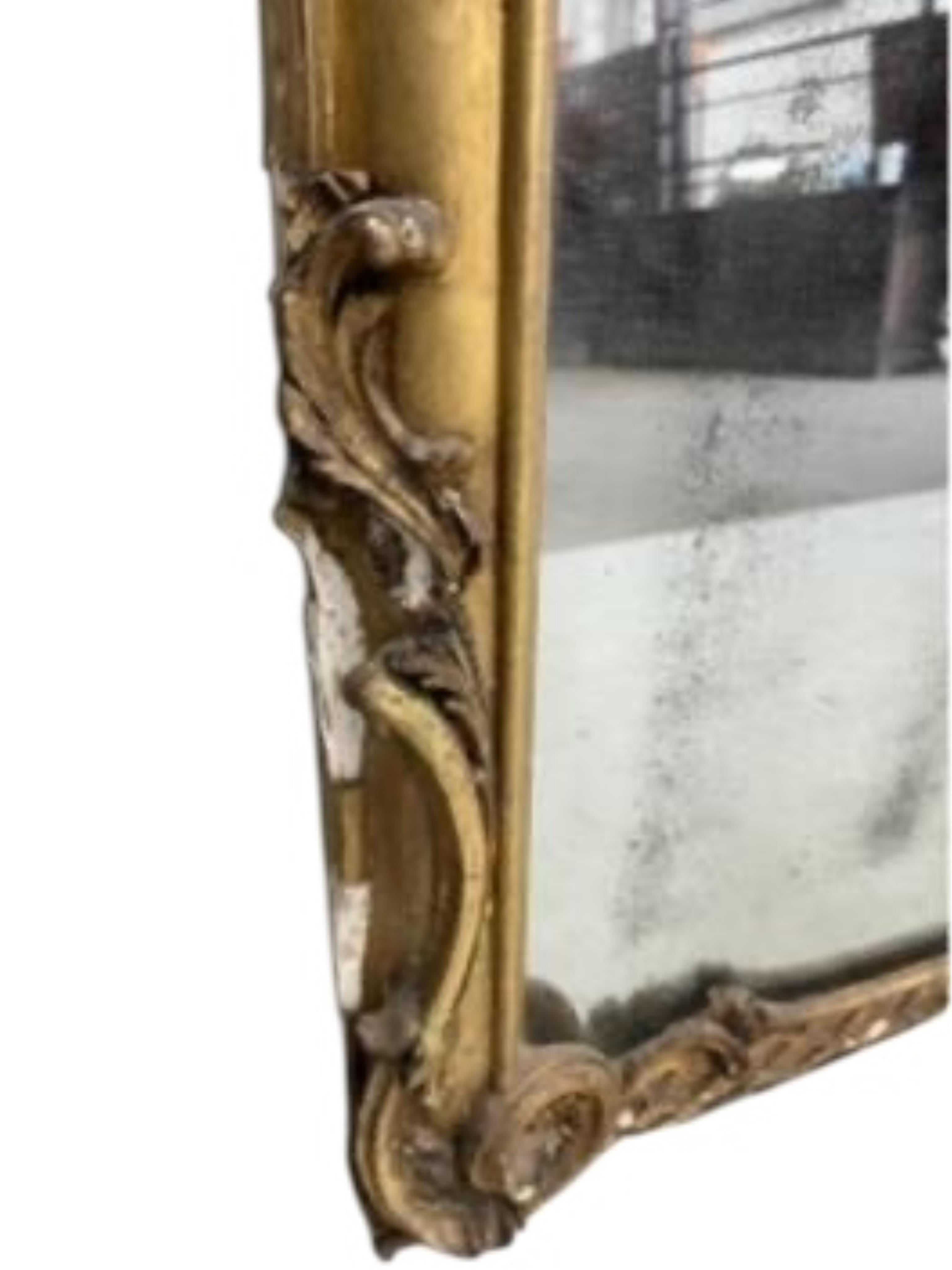 A Victorian carved giltwood and composition marble topped serpentine console table and mirror, width 132cm, height 177cm.
